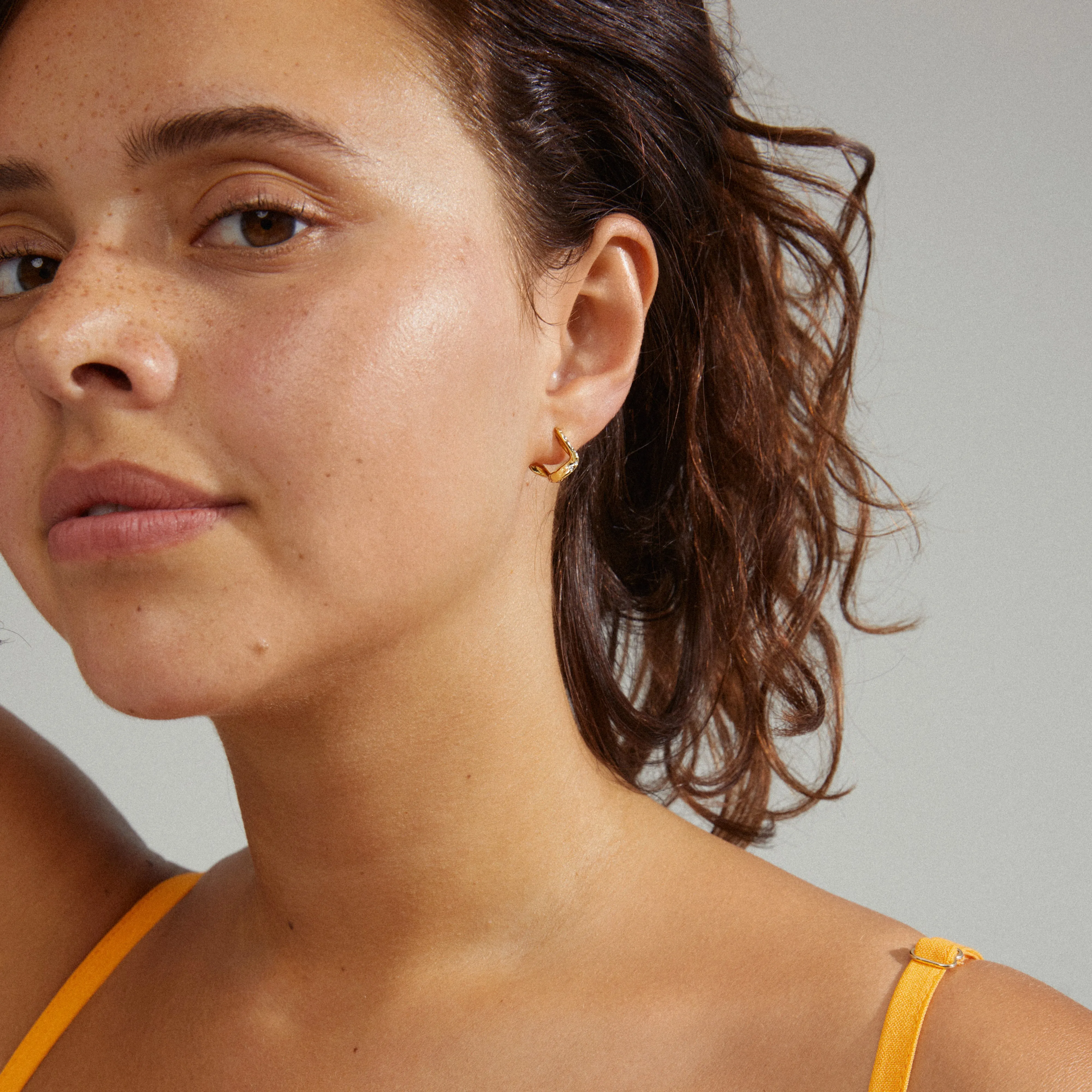 EVRA organic shaped crystal hoops gold-plated