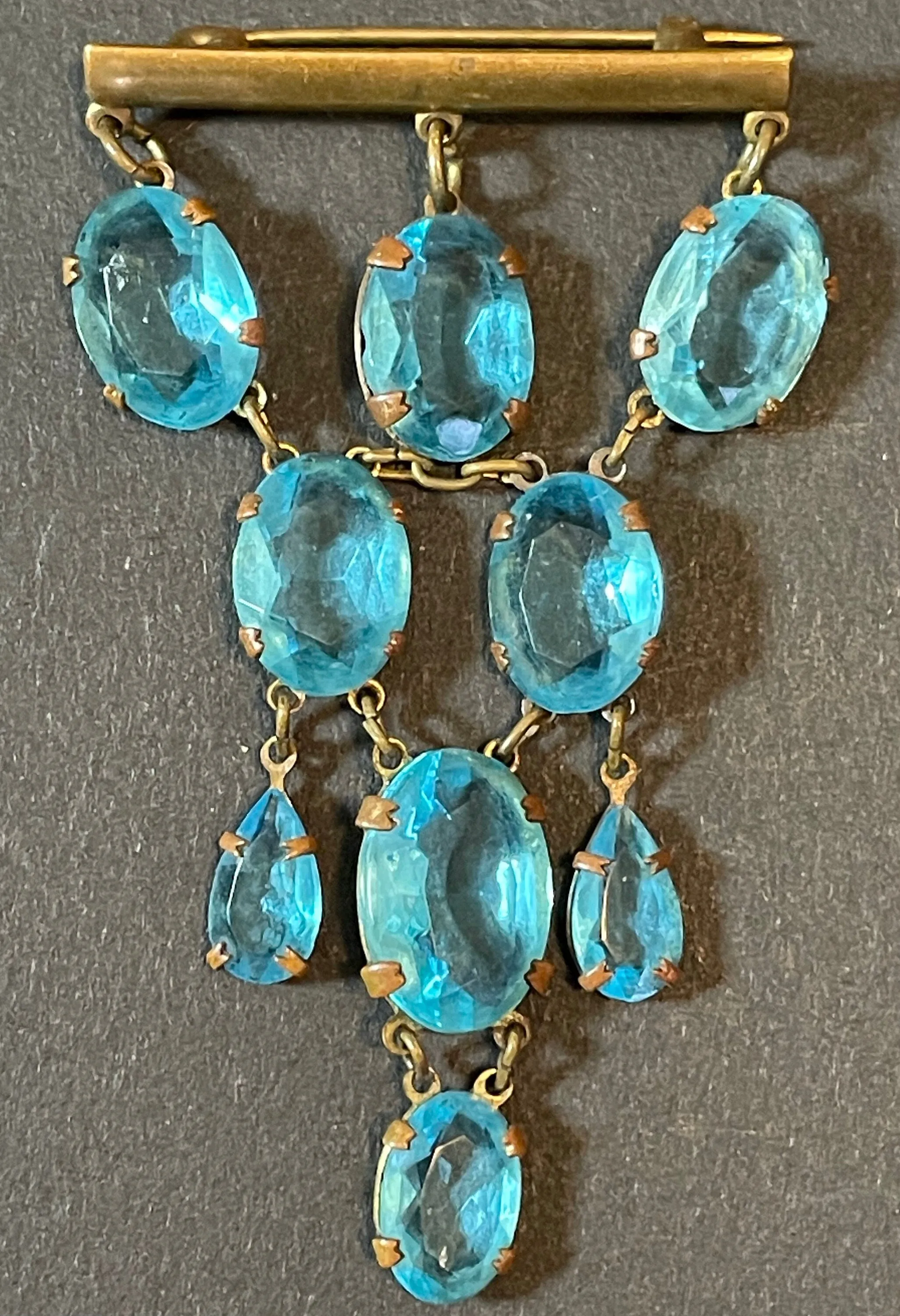 Vintage Art Deco aqua blue paste festoon dangle brooch with bezel set, open backed aquamarine coloured crystals set in antique gold tone
